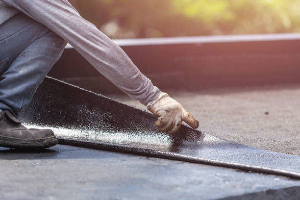 Professional Emergency Waterproofing technician working in West Olive, MI